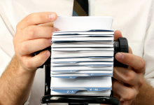 rolodex mans hands on address organize business